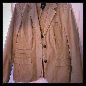 Tan blazer with yellow accent inside